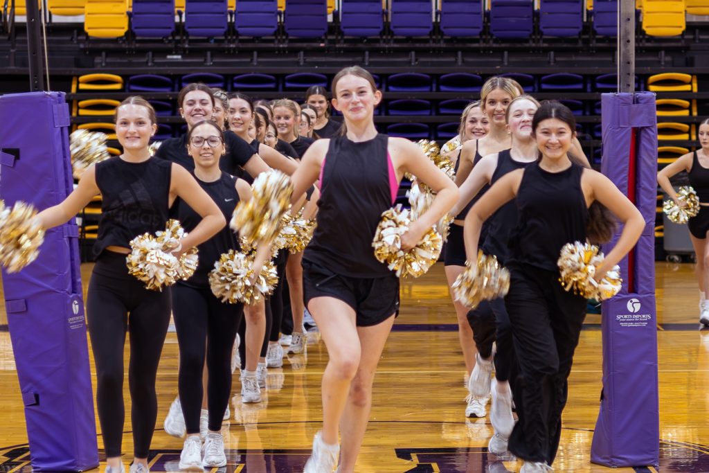 Thirty-six Belles stretch across the Wylie High School gym during practice. The 14th line is the largest in program history.