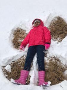 Hannah Varghese (3rd grade) making a snow angel!